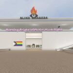 Futuristic building in white stone with three different floors. The blind burners logo featuring a burning eye symbol sits at the top of the building with the words 'Burning Bright with not much sight' above the building entrance. An LGBTQ flag is on the wall to the left of the entrance.